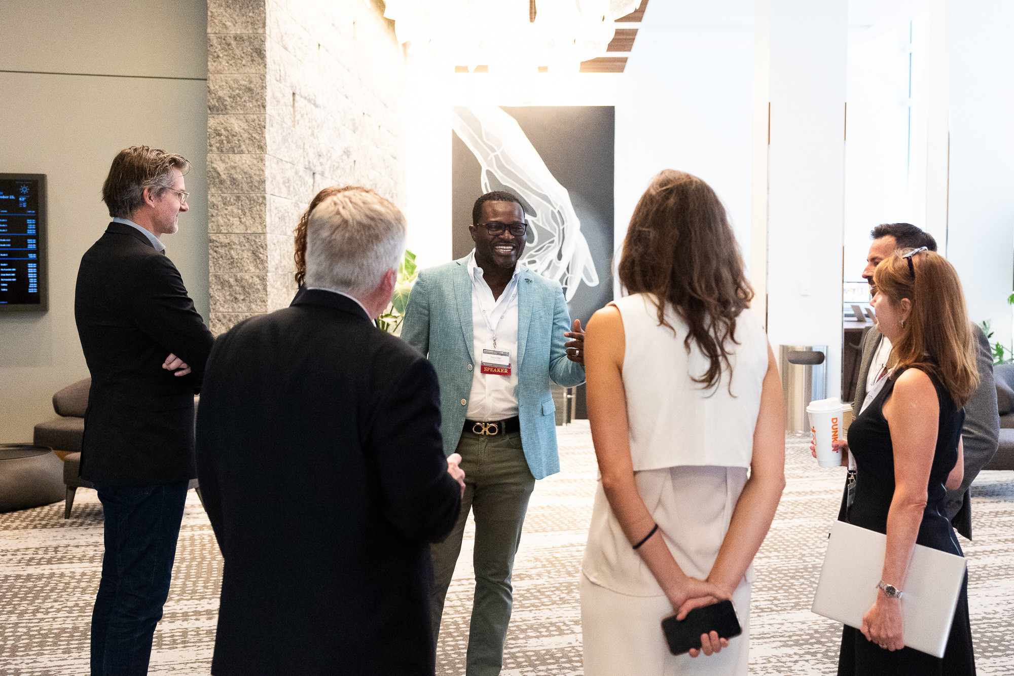 Y. Oni and others during a networking moment at Innovation Roadshow